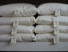 Organic cotton/ ECO-Pure wool Pillows stacked on a shelf