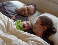 Mom with Dad and baby in safe chemical free wool sleep sytem