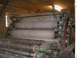 Organic mattress making started with carding of raw wool fibers Carding machine that straightens wool for organic mattresses
